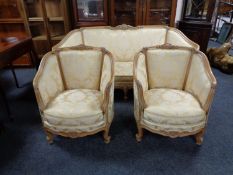 A three piece continental carved framed salon suite in classical fabric