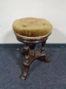 A Victorian revolving adjustable piano stool