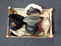 A box of six assorted military caps