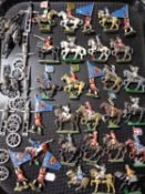 A tray of early twentieth century hand painted lead figures, military figures on horseback,