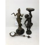 A French spelter figural clock and another figure of a torch bearer