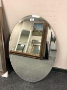 An all glass oval mirror