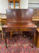 A Victorian mahogany tea table