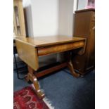 An antique mahogany sofa table fitted with a drawer