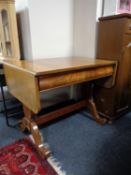 An antique mahogany sofa table fitted with a drawer