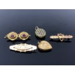 A group of Victorian pinchbeck jewellery comprising three brooches and two lockets (5)