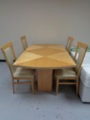 A high gloss reproduction dining table and four chairs