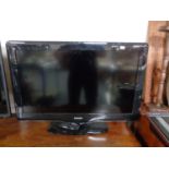 A Philips 32" LCD TV with remote (continental wiring)