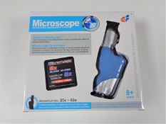 Forty-five boxed educational microscopes