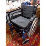 A folding Roma medical light weight wheel chair