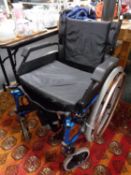 A folding Roma medical light weight wheel chair