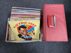 A case and box of vinyl LP's and 45's - world music,