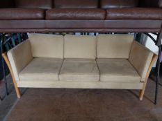 A twentieth century Danish wooden framed settee in suede fabric