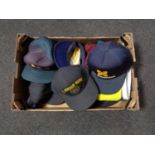 A box of peaked caps to include US marine Smit international USS Pamito,