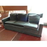 A mid century three seater settee in turquoise fabric