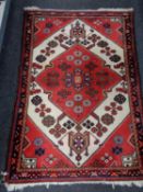 A Persian rug of geometric design,