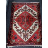 A Persian rug of geometric design,