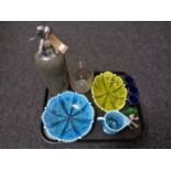 A tray of assorted glassware, soda Syphon, vaseline glass dish, green glass duck paperweight,