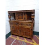 A carved oak buffet backed sideboard