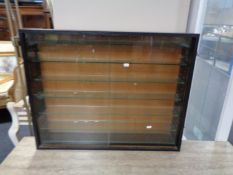 A sliding glass door curio display cabinet