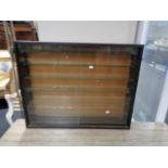 A sliding glass door curio display cabinet