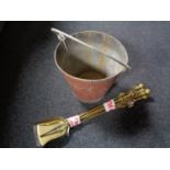A set of antique brass fire irons together with a fire bucket