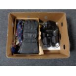 A box of Tasco binoculars, vintage leather cap,