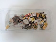 A quantity of pin badges,