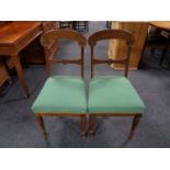 A pair of continental mahogany dining chairs