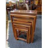 A nest of four oriental hardwood tables