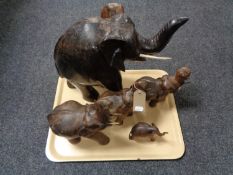 A tray of five hardwood elephants