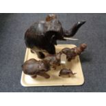 A tray of five hardwood elephants