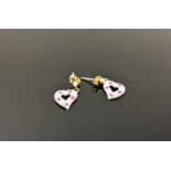 A pair of 10ct gold diamond and ruby set heart earrings