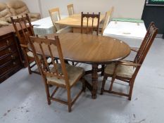 An Ercol extending table and four chairs