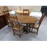 An Ercol extending table and four chairs