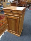 An antique pine pot cupboard