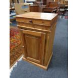 An antique pine pot cupboard