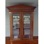 A Victorian mahogany bookcase top bearing Fry's advertising decoration