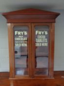 A Victorian mahogany bookcase top bearing Fry's advertising decoration