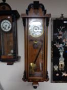 An early twentieth century walnut cased wall clock with brass and enamelled dial,