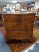 An antique mahogany three drawer chest