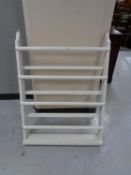 A painted white plate rack