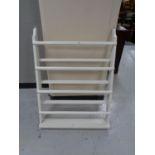 A painted white plate rack