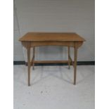 An oak arts and crafts occasional table