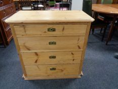 An antique pine four drawer chest