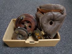 A box of leather head guard, two vintage AA badges, Scarborough fishing reel,