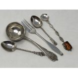 A silver straining spoon stamped 800, Baltic amber mounted silver spoon,