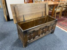 A twentieth century carved oak blanket box