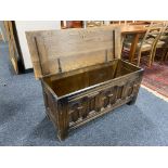 A twentieth century carved oak blanket box