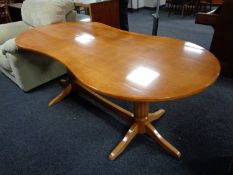 A shaped beech twin pedestal dining table